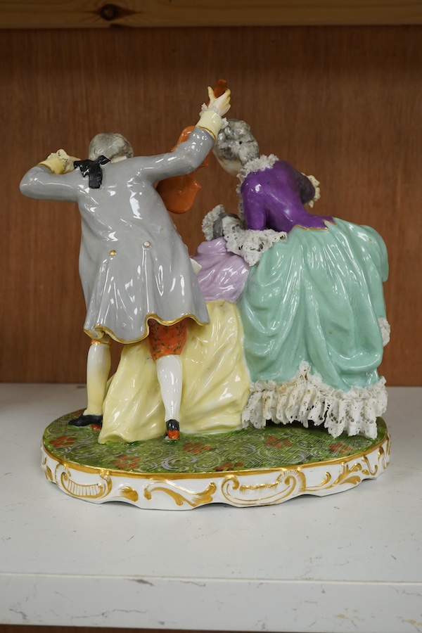 A large German porcelain group of ladies and a violinist, early 20th century, 23cm high